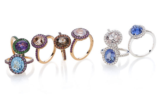 18Kt gold rings with precious stones.